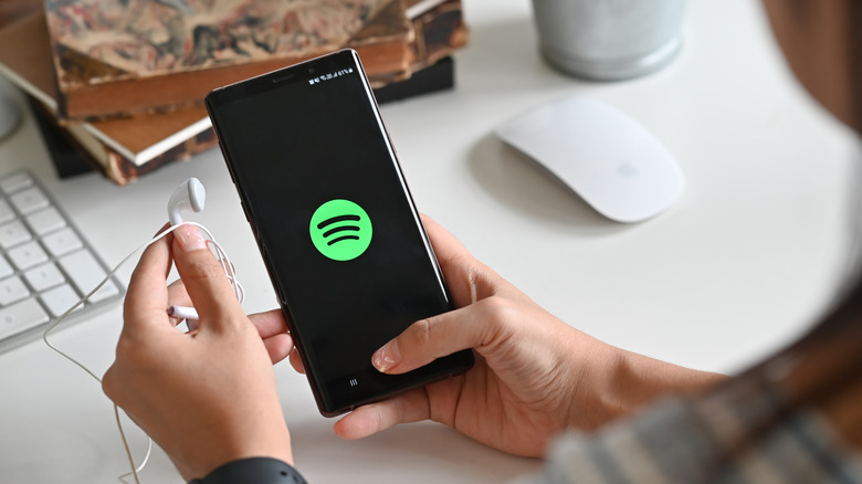 Person using Spotify app