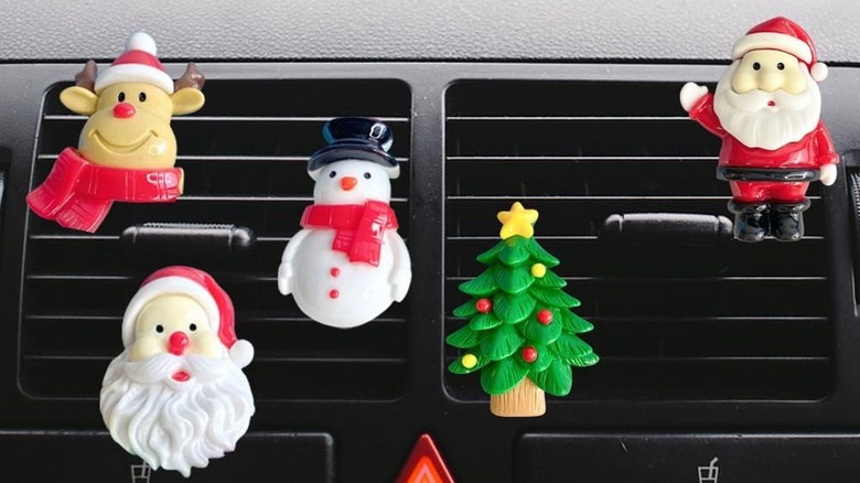 Christmas air-vent clips including Santa, a snowman and a Christmas tree