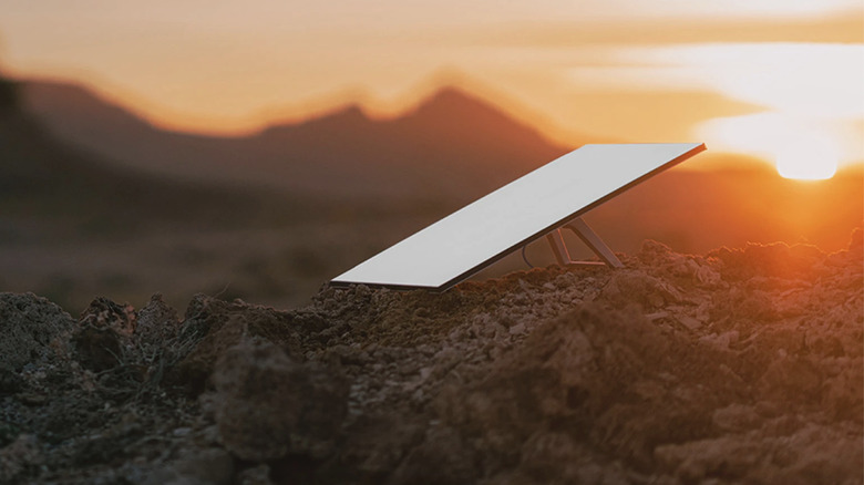 Starlink dish on the ground at sunset