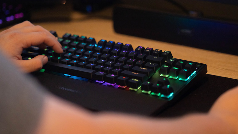 Person using gaming keyboard