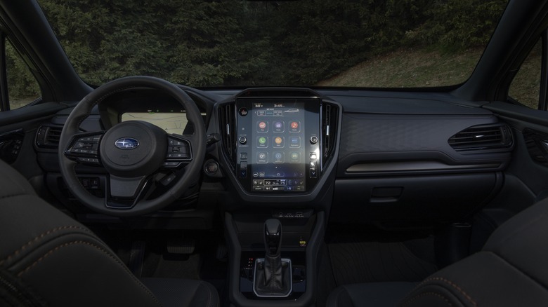 The dashboard and a view out the windshileld of the 2025 Subaru Forester Hybrid .