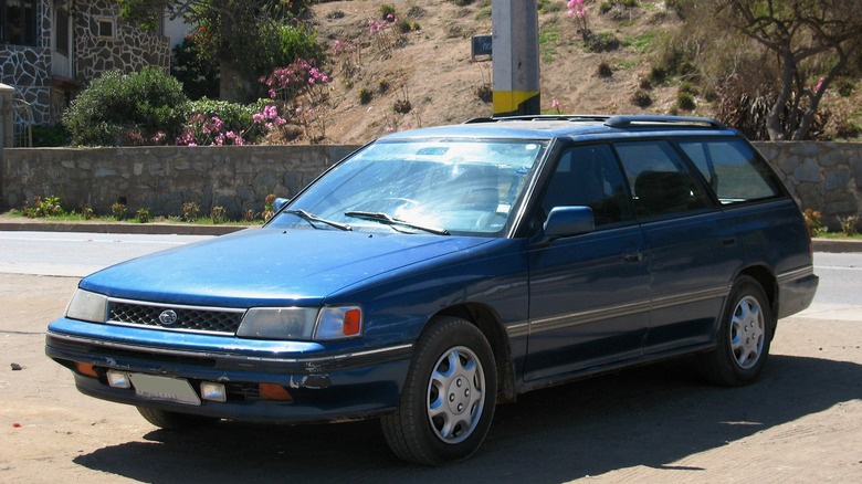 Blue Subaru Legacy wagon parked