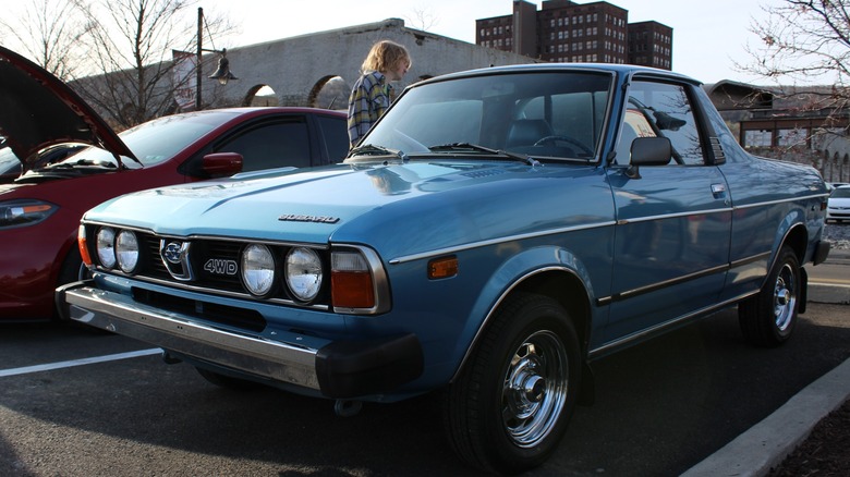 Blue Subaru BRAT parked at a car meet