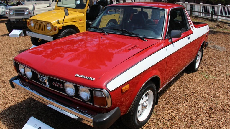 Red Subaru BRAT on display at a car show