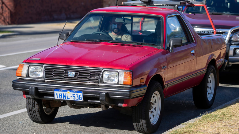 Red Subaru Brumby parked on the roadside