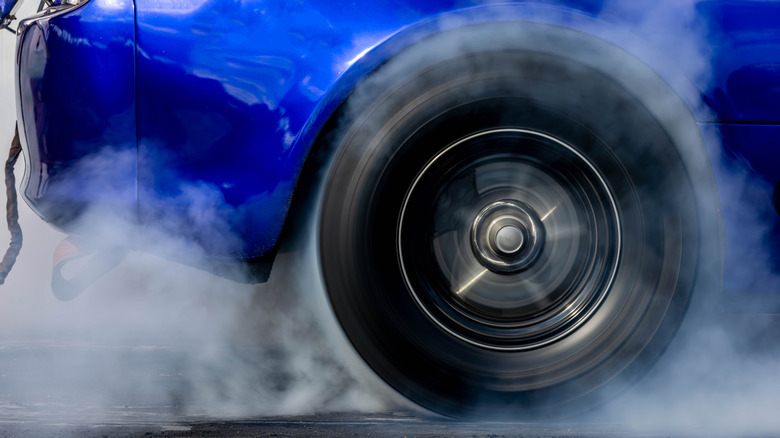 Close up of dragster wheel doing a burnout