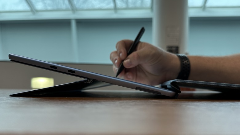 Man writing on a tablet