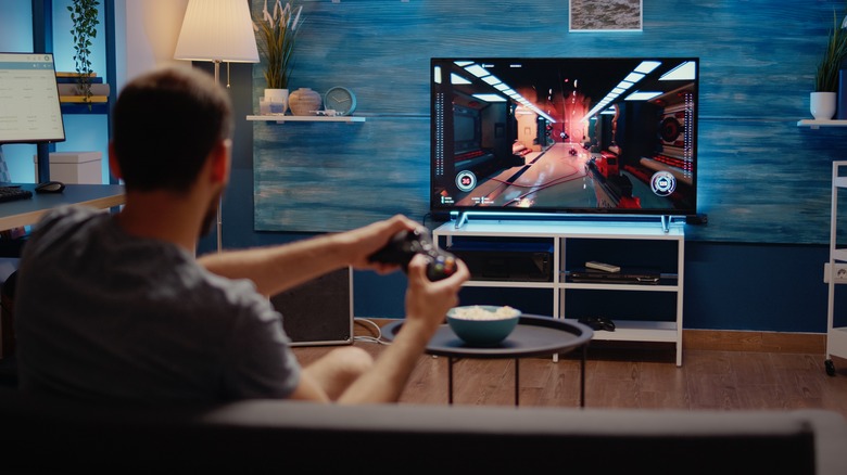 A person using a smart TV for gaming