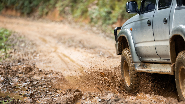 Truck driving on unpaved road