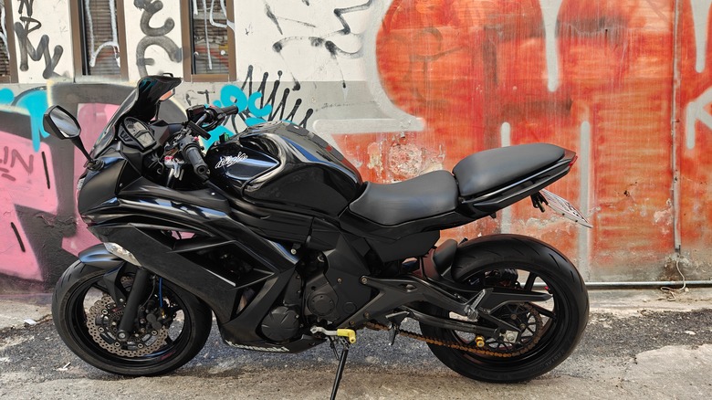 Kawasaki Ninja parked next to building