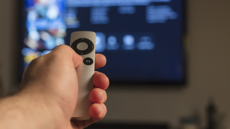 Apple TV remote in hand