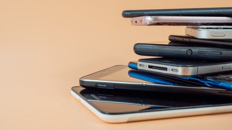 Old smartphones stacked on top of each other