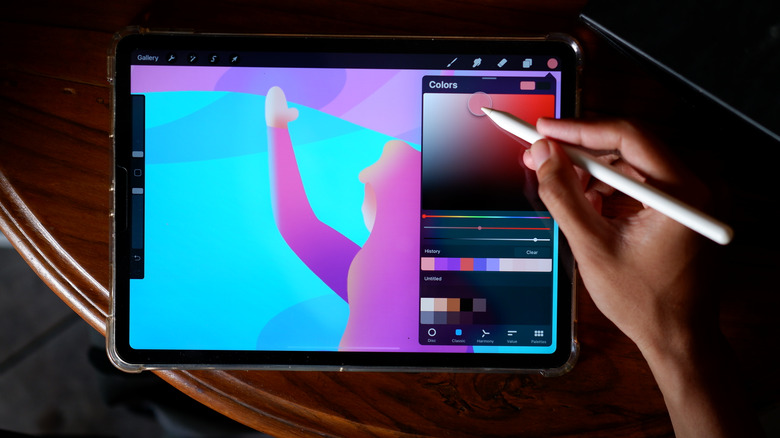 apple pencil being used with procreate ipad app