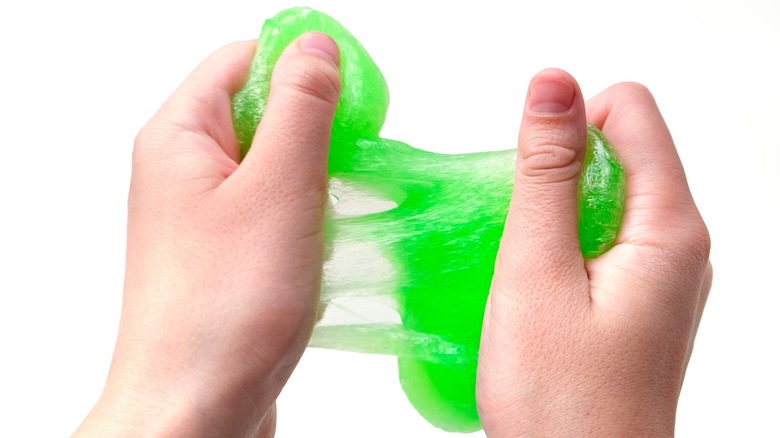 silly putty on hand