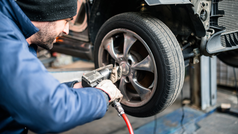 Mechanic changing car tire