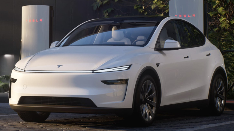 Front end of the new Tesla Model Y 'Juniper' electric car parked at Tesla charging station