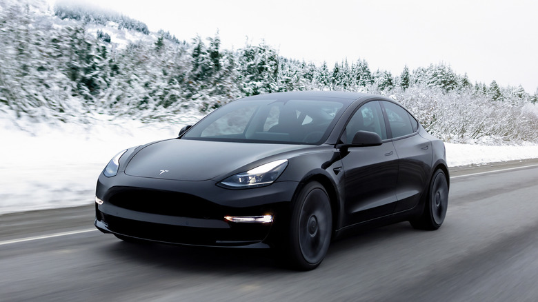 Tesla Model 3 driving snow road