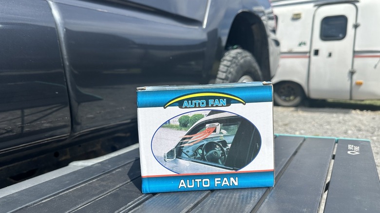 Auto Fan product in box sitting on table outside