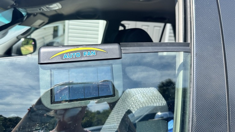 Auto Fan sitting on car window