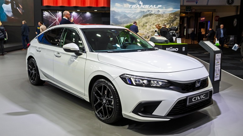 White Honda Civic Hybrid on display indoors