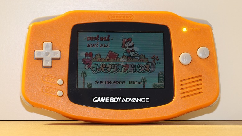 A yellow Game Boy Advance on a white background