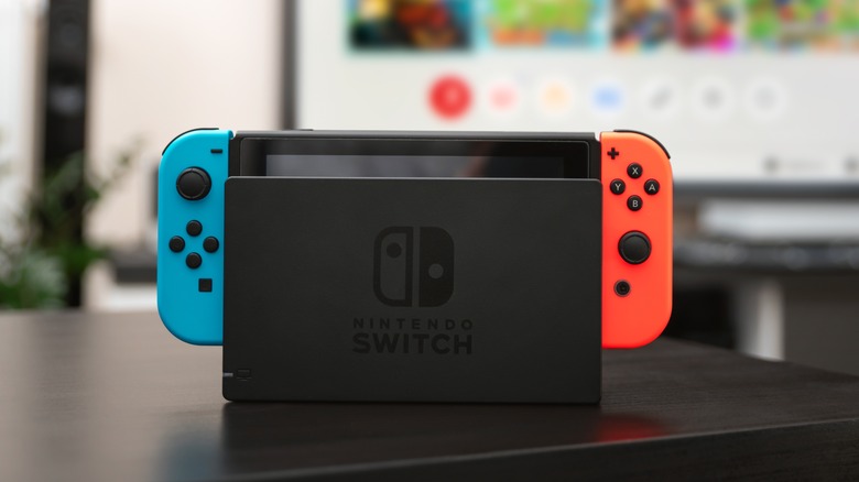 A Nintendo Switched docked with two joycons attached