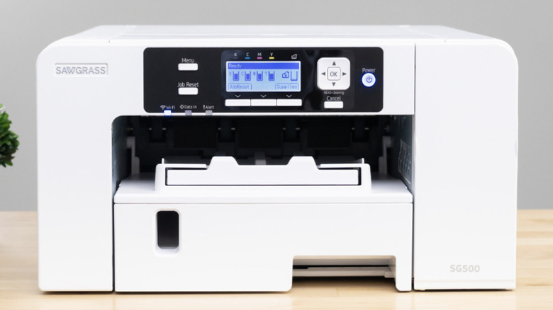 A Sawgrass SG500 Sublimation printer resting on a desk. 