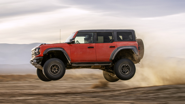 Ford Bronco Raptor jumping over a dune