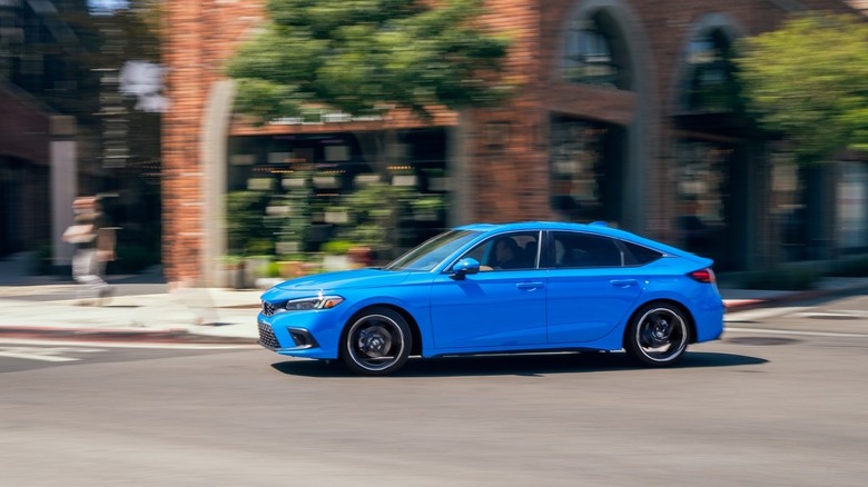 Honda Civic hatchback side profile at speed