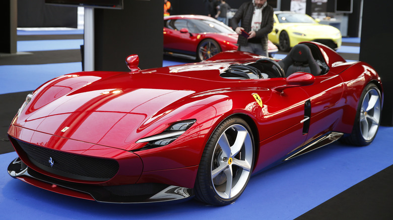 Red Ferrari Monza SP1 at a concours event