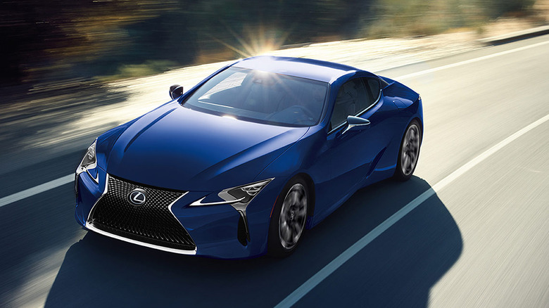 2024 Lexus LC 500h hybrid grand-touring coupe driving at speed