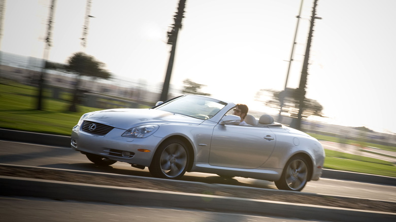 Grey 2010 Lexus SC 430 driving at speed