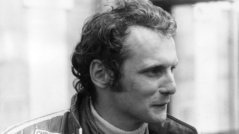 Niki Lauda smiling in his racing gear