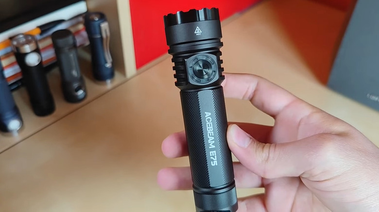 Acebeam E75 flashlight in hand