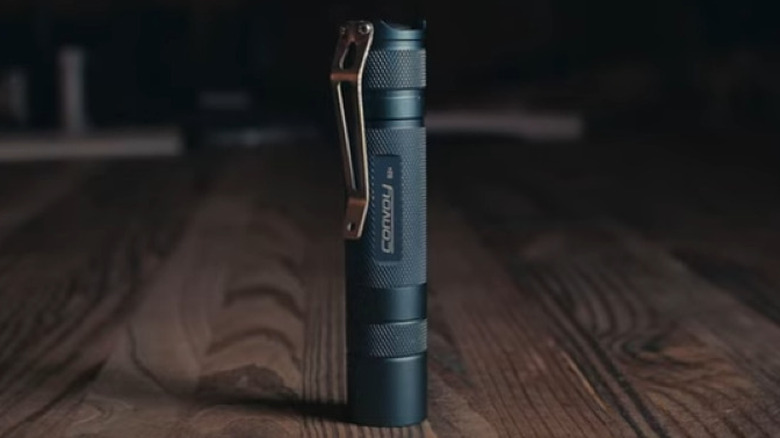 Convoy flashlight on tabletop