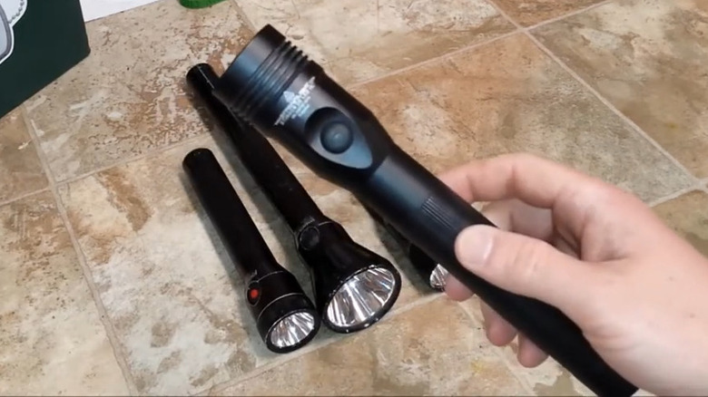 Streamlight Stinger held above other flashlights