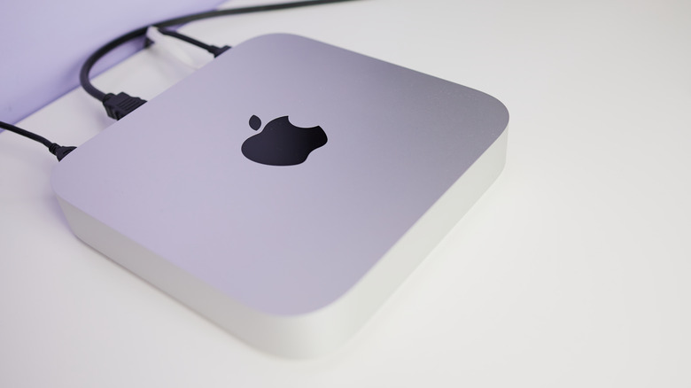 Apple Mac mini (M1, 2020) sitting on a white desk