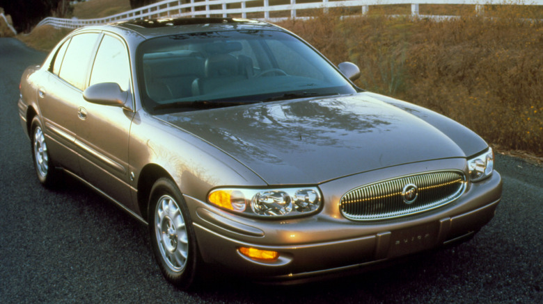 brown Buick LaSabre on road