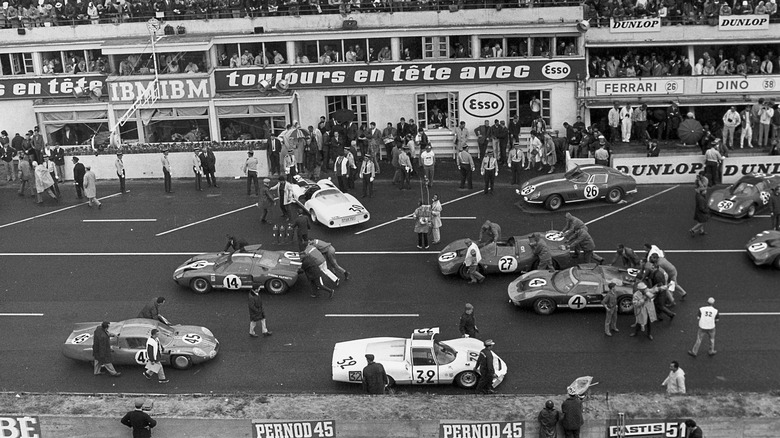 Cars pushed to the starting grid at Le Mans 1966