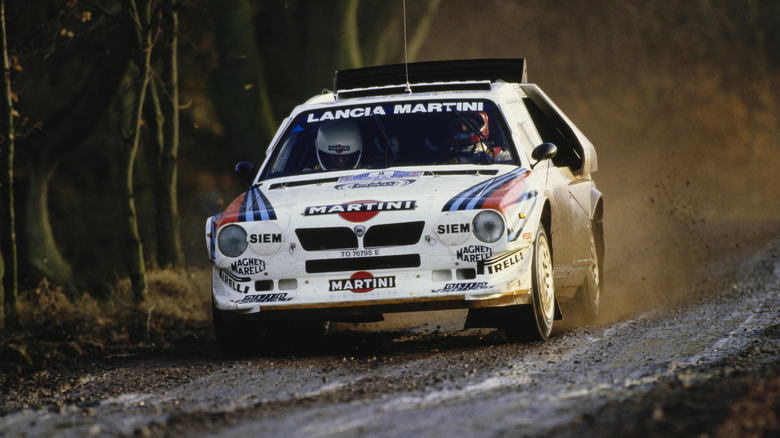 Lancia Delta S4 going over a crest