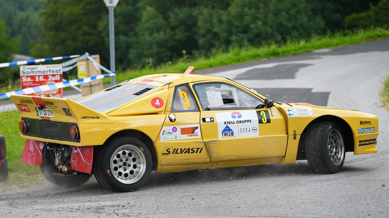 A yellow Lancia Rally 037