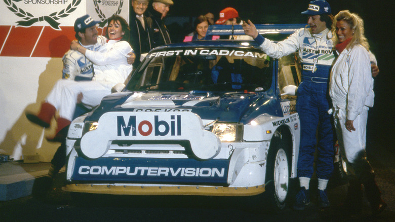 Team celebrating with MG Metro 6R4