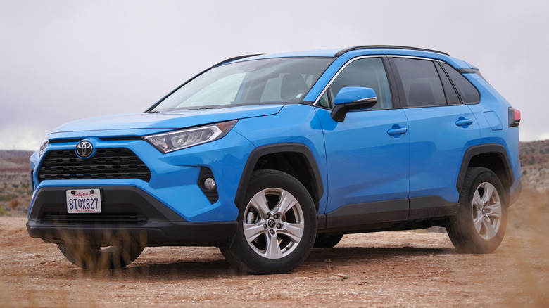 Blue 2022 Toyota RAV4 on gravel road