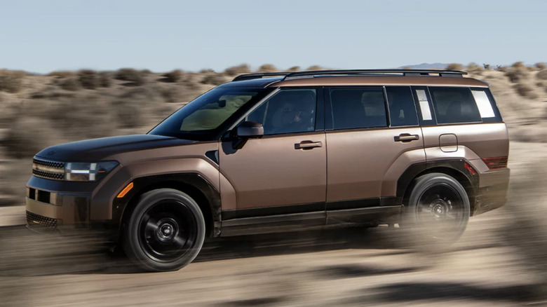 A brown Hyundai Santa Fe driving through the desert