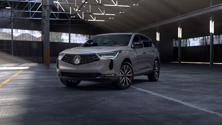 A gray Acura RDX in a parking garage