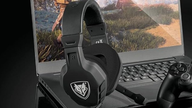 The NUBWO U3 Gaming Headset with a laptop and controller.