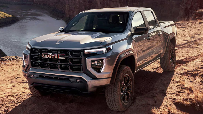 A GMC Canyon driving in the dirt