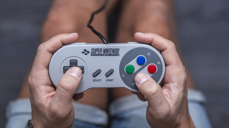 Man playing with SNES controller