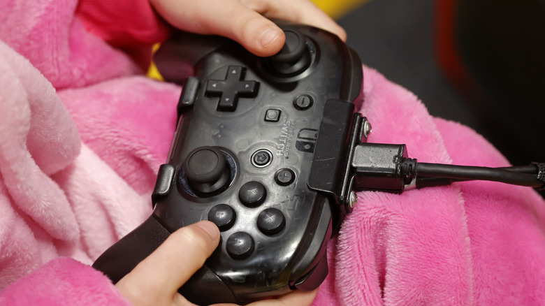 Girl using Switch Pro Controller