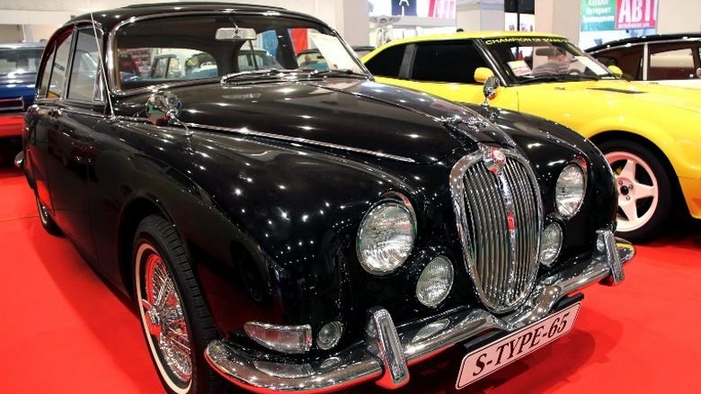 black Jaguar S-Type on showroom floor